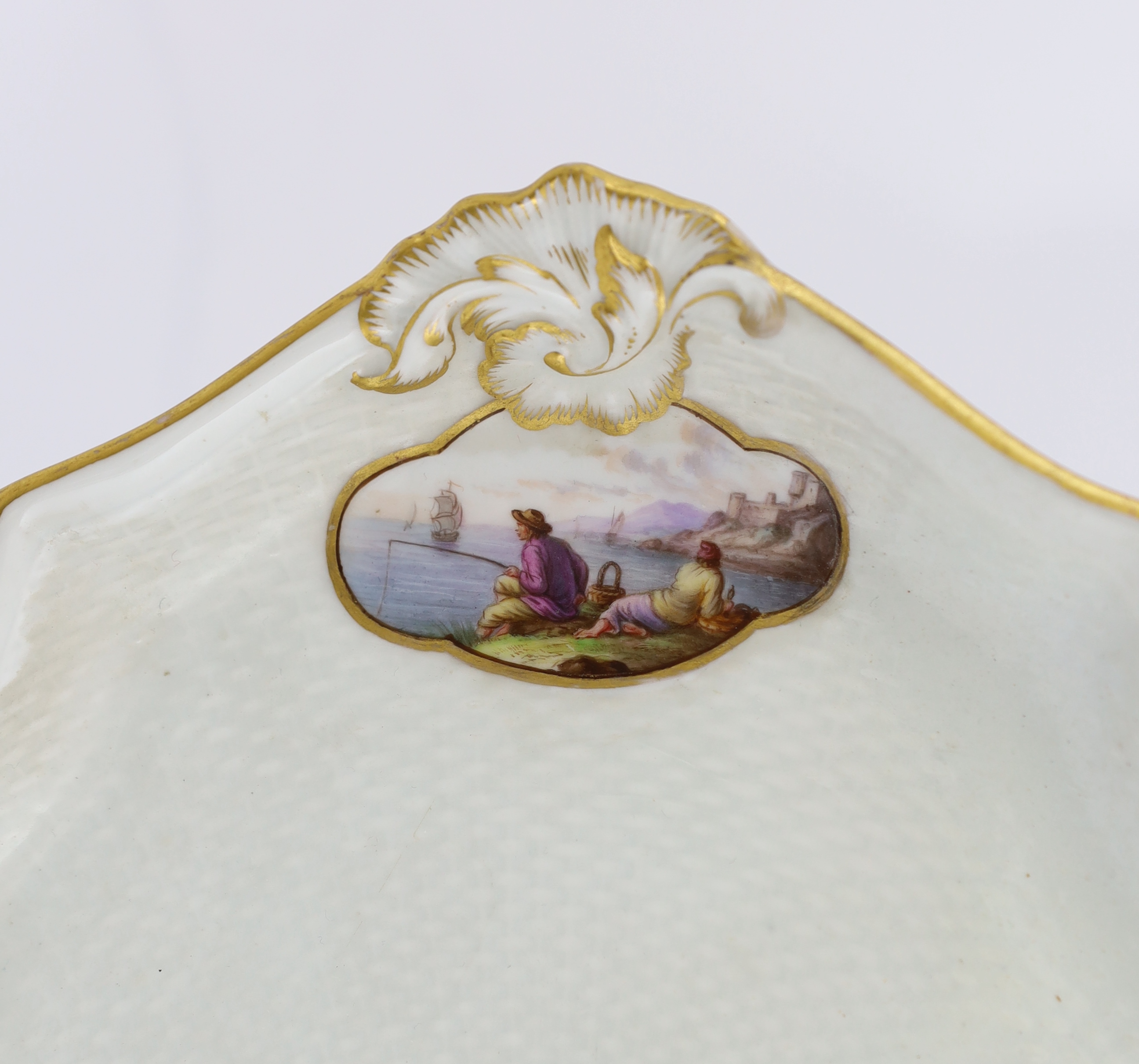 A Meissen porcelain lozenge shaped tray, 19th century, broken and restored